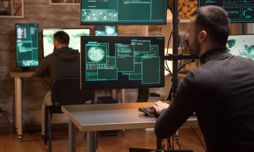 Back view of dangerous team of hackers