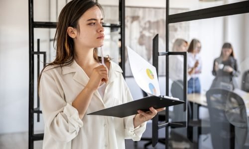 side-view-woman-office-with-clipboard-scaled-1.jpg